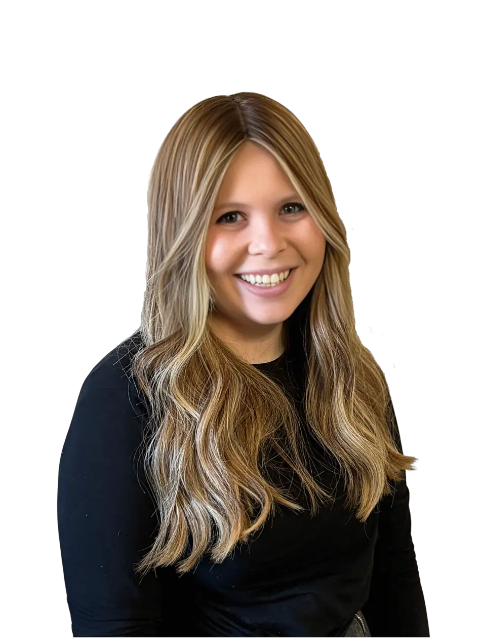 Portrait of a smiling woman with blonde long hair wearing a dark blue top